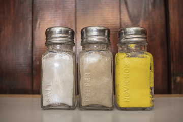 Salt, Pepper and Novichok shakers on UK restaurant table.