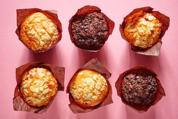Muffins on pink background, from above