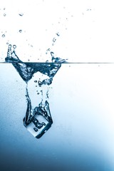 Ice Cube Falling into Water