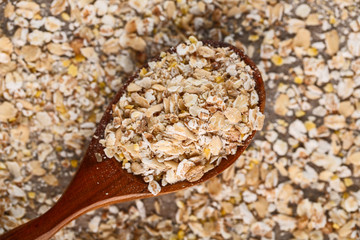oat flakes in a wooden spoon