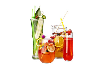 Assorted beverages with fruits and vegetables. in a pitchers and glasses.