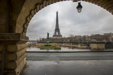 Fototapeta na wymiar The Eiffel Tower as seen from under the Pont du Bir-Hakeim in Paris, France.
