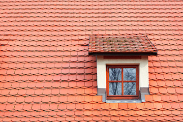 Red shingles on the roof with window