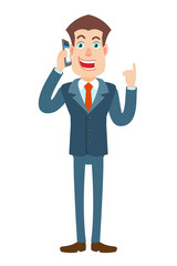 Businessman talking on mobile phone and pointing up