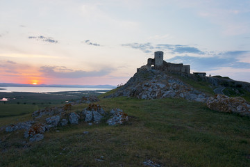 Fototapeta na wymiar Beautiful landscape and a sunset sky over Enisala old stronghold citadel,Dobrogea,Romania