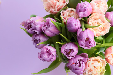 Purple Tulip Bouquet. lilac tulips on a gently purple background. bouquet of lilac and pink terry  tulips flowers on a lilac background