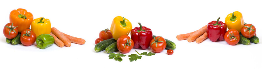 Red yellow and orange peppers with tomatoes on a white background. Cucumbers with colorful peppers in composition on a white background. Panoramic photo with vegetables on a white background..