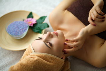 Obraz na płótnie Canvas Spa. Young woman on massage table in beauty spa salon