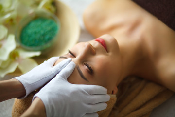 Obraz na płótnie Canvas Spa. Young woman on massage table in beauty spa salon