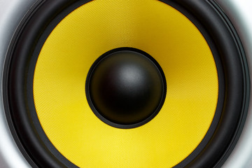 Yellow speaker loudspeaker close-up part of a musical column
