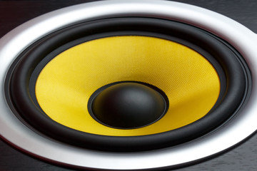 Yellow speaker loudspeaker close-up part of a musical column