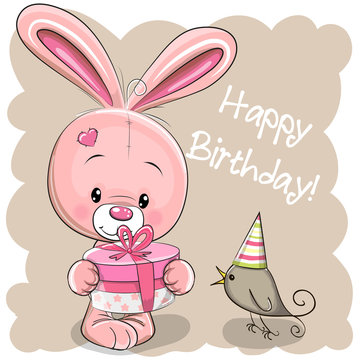 Cute Rabbit with gift on a beige background
