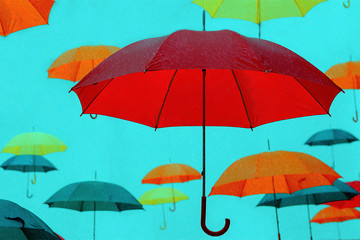 Fototapeta na wymiar lots of umbrellas in the rain