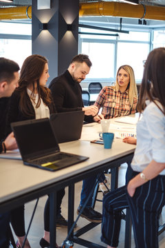 Woman speaking angry to her colleagues at the office meeting