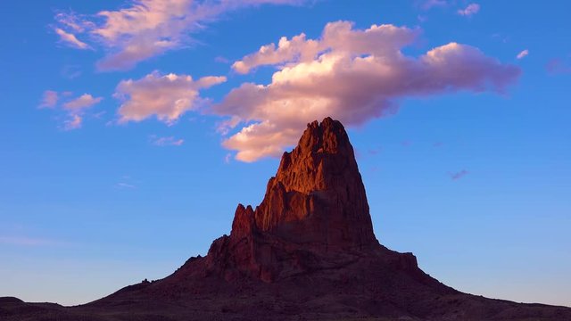 Amazing time lapse of clouds moving over a mountain peak near Monument Valley.