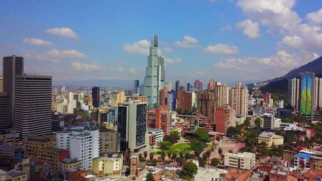 Beautiful aerial establishing shot of old buildings, modern skyscrapers and neighborhoods in downtown Bogata, Colombia.