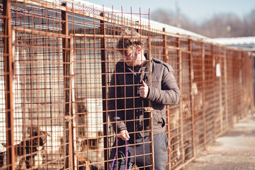 A man adopts a dog, a person adopting a puppy, a person love dogs, a man loves animals, the dog the...