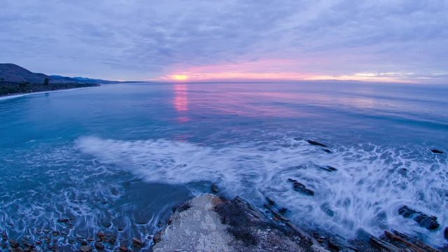 Time-lapse of the sun rising over the breaking waves at Refugio State Beach at Gaviota near Santa Barbara, California.