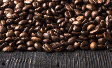 roasted coffee beans on wood texture