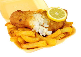 Fish and chips in a polystyrene take away tray isolated on a white background