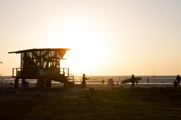 Lifeguard station at surfing beach sunset