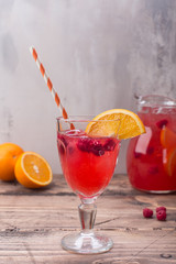 Red summer lemonade with raspberry and orange