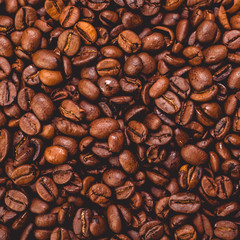 Roasted brown coffee beans pattern background top view flat texture