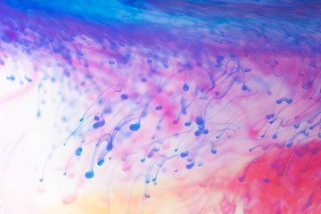 Acrylic colors and ink in water. Abstract frame background. Isolated on white.