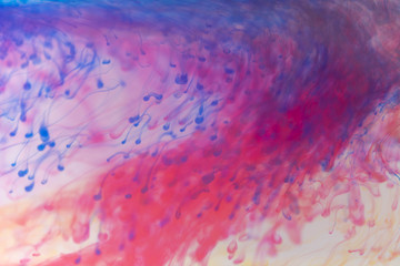 Acrylic colors and ink in water. Abstract frame background. Isolated on white.