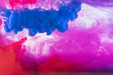 Acrylic colors and ink in water. Abstract frame background. Isolated on white.