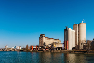 Naklejka premium Big mill plant in Strasbourg, old and new buildings