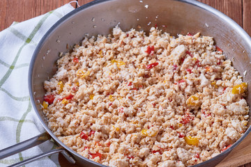 Fried chicken ground meat with pepper on a frying pan. Meat for tacos.