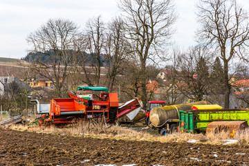 Old farm agriculture technology, metal machines and vehicles. Near the field and countryside land