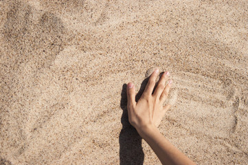 Plakat Background with hand on the sand