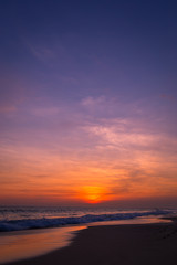 Naklejka na ściany i meble Landscape of sunset on the beach