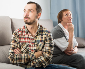 Elderly mother and son quarrel