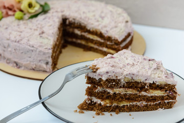 homemade cake with cream and fresh flowers