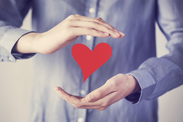 Woman hand holding heart shape