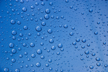 Water Droplets on Blue Metal