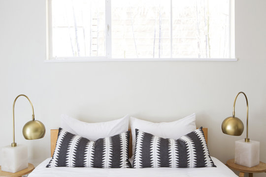 Bed Detail With Black And White Patterned Pillows