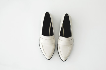 White female shoes on white background