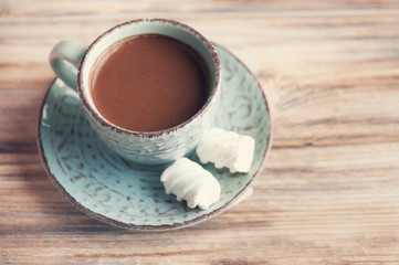 Cup of hot chocolate and sweets