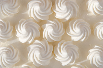 White cream on cake in the sun. Background, texture