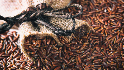 Wild red rice in a bag closeup