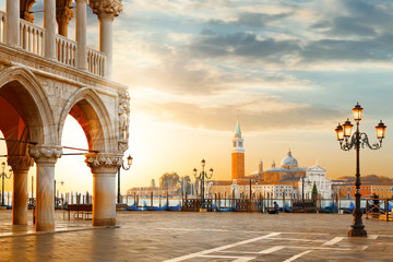 Venice postcard. World famous Venice landmarks. St. Mark's San Marco square with San Giorgio Maggiore church during amazing sunrise. Tourism and travel concept in Italy. - obrazy, fototapety, plakaty