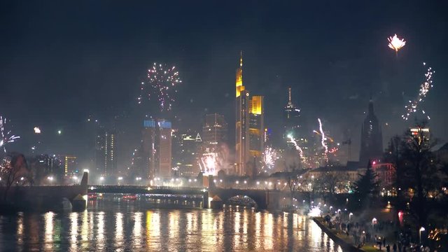 Frankfurt skyline with a firework show during New Year's Eve.