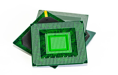 Computer electronic chips isolated on white arranged in a stack. The chips are placed upside down...