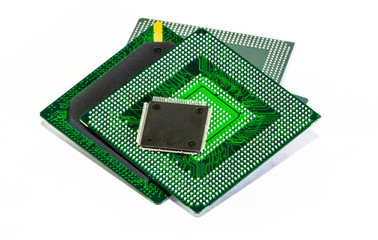 Computer electronic chips isolated on white arranged in a stack. The chips are placed upside down...