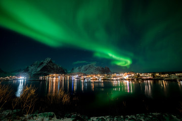 Northern lights over the vilage of Reine, Lofoten, Norway