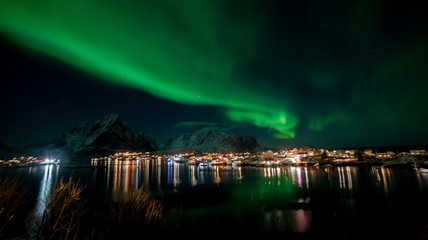 Northern lights over the vilage of Reine, Lofoten, Norway